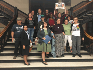 A group of Solidarity Lowell members after speaking at City Hall in favor of the Safe Communities Act
