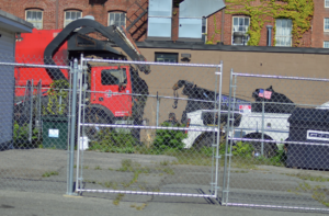 One killed, one injured by reversing garbage truck on narrow street in Lowell